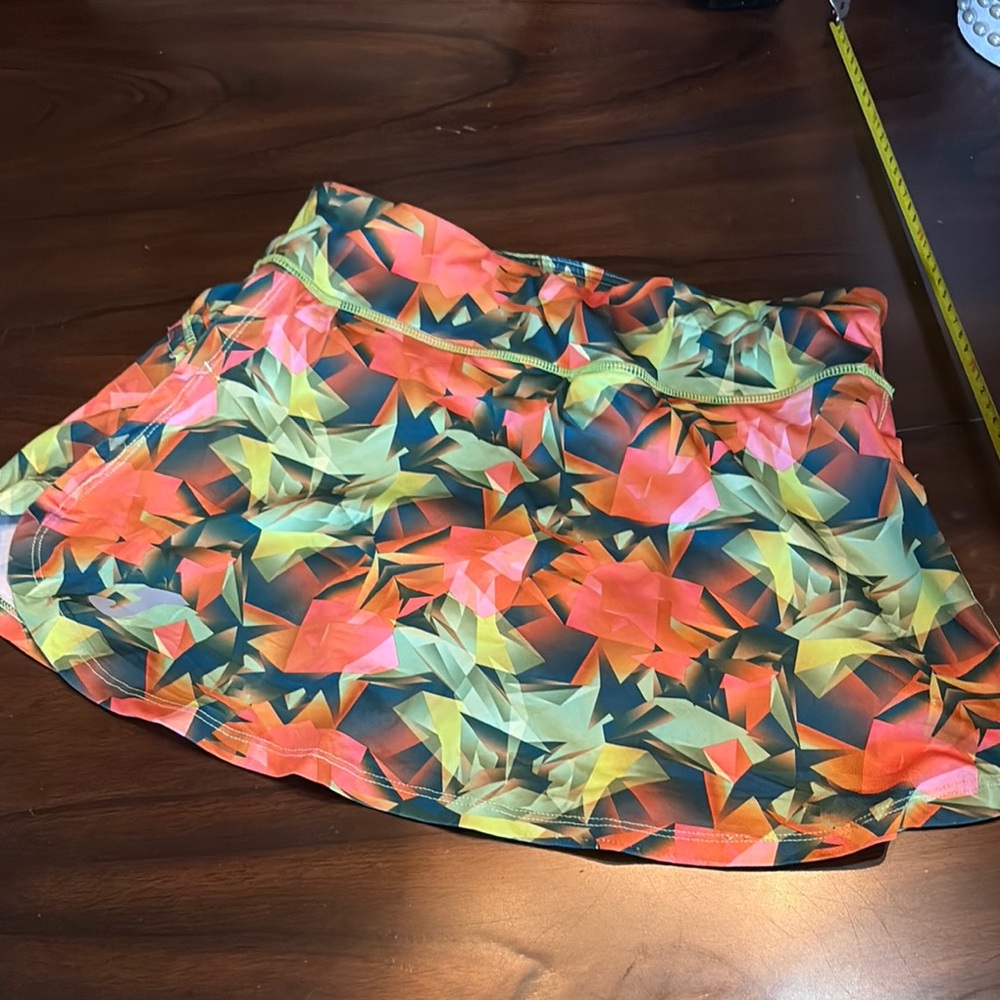 Joma DryMX Ruffle detail back Vibrant Geometric Athletic Stretch Skort
